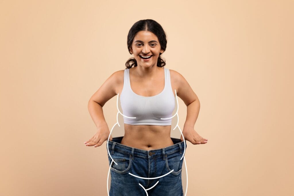 Woman showing results from her weight loss program