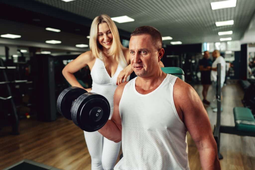 man and woman trying to gain muscle mass