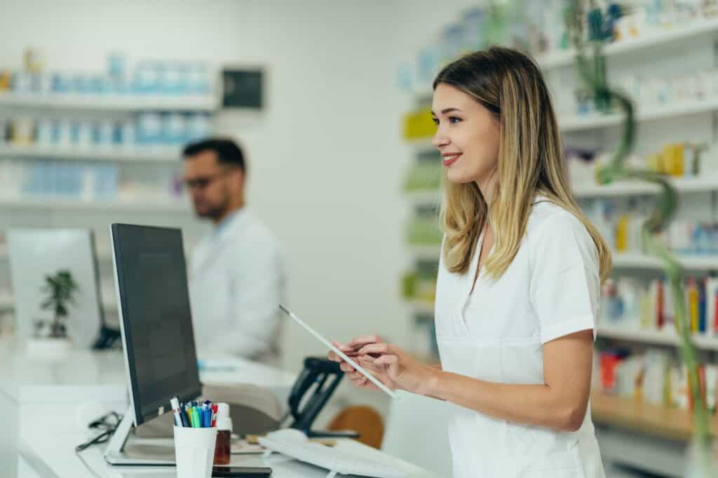 Woman working at a compounding pharmacy.