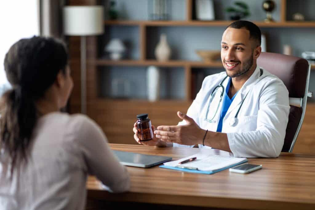 An illustration of a healthcare provider consulting with a patient about compounded medications.